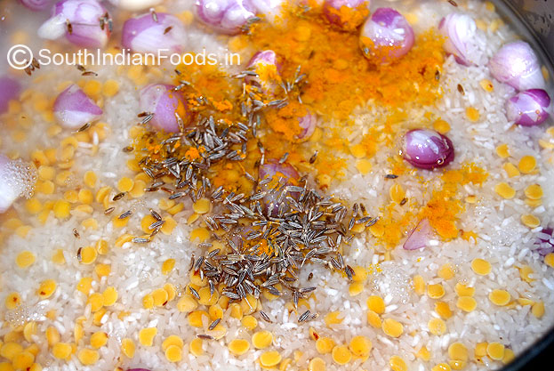 Add cumin seeds, turmeric powder and water. cook for 4 whistles